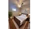 Staged main bedroom with neutral walls, wood furniture, and natural light at 742 Aquadale Rd, Albemarle, NC 28001