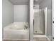 Bathroom featuring a soaking tub and a separate shower with glass doors at 8353 Ainsworth St, Charlotte, NC 28216