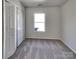Another carpeted bedroom with a window and closet for ample storage space at 8353 Ainsworth St, Charlotte, NC 28216