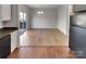 Open-concept dining area adjacent to the kitchen, featuring sliding glass doors to the exterior at 8353 Ainsworth St, Charlotte, NC 28216