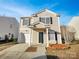 Charming two-story home with a well-maintained front yard and attached garage at 8353 Ainsworth St, Charlotte, NC 28216