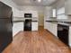 Bright kitchen with white cabinets, modern appliances, and ample counter space at 8353 Ainsworth St, Charlotte, NC 28216