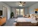 Cozy bedroom with a ceiling fan, natural light, and neutral decor at 8353 Ainsworth St, Charlotte, NC 28216