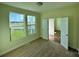 Bright bedroom with large windows offering a view of the outdoors and neutral carpeting at 1022 Heath Helms Rd, Monroe, NC 28110