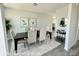 Elegant dining room featuring wood floors, a modern chandelier, and stylish decor at 1022 Heath Helms Rd, Monroe, NC 28110