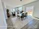 Inviting dining area that flows into an open kitchen with a view of the outdoor deck at 1022 Heath Helms Rd, Monroe, NC 28110