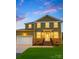 Charming two-story home with attached garage, neutral color palette, and manicured front lawn at 1022 Heath Helms Rd, Monroe, NC 28110