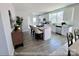 Well-lit kitchen featuring white cabinetry, stainless steel appliances, and a large kitchen island at 1022 Heath Helms Rd, Monroe, NC 28110