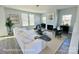 Cozy living room with a fireplace, light gray walls, and a large window offering ample natural light at 1022 Heath Helms Rd, Monroe, NC 28110