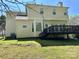 Exterior shot of home with a deck, backyard, siding, windows and architectural details at 10550 Worsley Ln, Charlotte, NC 28269
