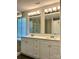 Bathroom featuring double sink vanity and walk-in shower at 10550 Worsley Ln, Charlotte, NC 28269