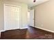 Bedroom featuring closet, carpeted floor, and neutral paint, offering a cozy space for relaxation and storage at 10550 Worsley Ln, Charlotte, NC 28269
