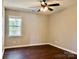 Comfortable bedroom featuring a window offering outdoor views, enhancing the room's natural light and atmosphere at 10550 Worsley Ln, Charlotte, NC 28269
