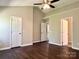 A bedroom area has wood floors and multiple doors at 10550 Worsley Ln, Charlotte, NC 28269