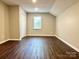 Neutral bedroom features a window and a closet at 10550 Worsley Ln, Charlotte, NC 28269