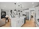 Open-concept kitchen with large island, stainless steel appliances, and a farmhouse sink at 1056 Kinship Dr # 113, Lancaster, SC 29720