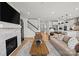 Bright living room featuring a fireplace, hardwood floors, and an open layout to kitchen at 1056 Kinship Dr # 113, Lancaster, SC 29720