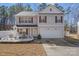 Daytime shot of a charming two-story home featuring manicured landscaping and a two-car garage at 10816 Pointer Ridge Dr, Charlotte, NC 28214