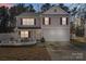 Two-story home with neutral siding, red shutters, a two-car garage, and landscaping at 10816 Pointer Ridge Dr, Charlotte, NC 28214