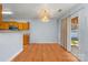 Eat-in-kitchen and dining area features a chandelier and sliding glass doors to the patio at 10816 Pointer Ridge Dr, Charlotte, NC 28214