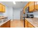 Kitchen features wood cabinets, stainless steel appliances, and stone countertops at 10816 Pointer Ridge Dr, Charlotte, NC 28214