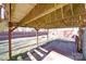 View of backyard with a brick patio, grassy area, and a wooden fence at 115 Scotch Irish Ln, Troutman, NC 28166