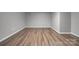 Finished basement with modern wood-look flooring and neutral paint at 115 Scotch Irish Ln, Troutman, NC 28166
