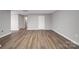 Finished basement area with modern wood-look flooring and neutral paint at 115 Scotch Irish Ln, Troutman, NC 28166