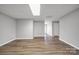 Spacious basement with wood-look flooring, neutral paint, and recessed lighting at 115 Scotch Irish Ln, Troutman, NC 28166