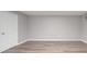 Finished basement with wood-look flooring and neutral paint at 115 Scotch Irish Ln, Troutman, NC 28166