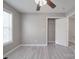 Bedroom with luxury vinyl plank flooring, a ceiling fan, and a closet at 115 Scotch Irish Ln, Troutman, NC 28166