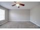 Bedroom with neutral walls, carpet floors, a ceiling fan and a bright window at 115 Scotch Irish Ln, Troutman, NC 28166