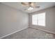 Cozy bedroom features plush carpeting, neutral paint, and a bright window at 115 Scotch Irish Ln, Troutman, NC 28166