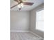 Bedroom with luxury vinyl plank flooring, a ceiling fan, and a window at 115 Scotch Irish Ln, Troutman, NC 28166