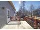 Exterior view of a wooden deck and stairs leading to the grassy backyard at 115 Scotch Irish Ln, Troutman, NC 28166