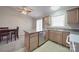 Bright kitchen with a kitchen island, stainless steel dishwasher, and a view of a dining table at 115 Scotch Irish Ln, Troutman, NC 28166