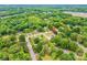 An aerial view of the property nestled within a lush, green, tree-filled neighborhood at 119 Era St, Troutman, NC 28166
