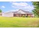 Lush backyard with a storage shed and mature landscaping, creating a serene outdoor retreat at 119 Era St, Troutman, NC 28166