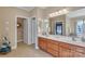Bathroom featuring a double sink vanity with wood cabinets and plenty of space for personal care items at 119 Era St, Troutman, NC 28166