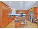 Expansive kitchen with custom wood cabinetry, stainless appliances, and a large center island with seating at 119 Era St, Troutman, NC 28166