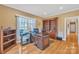 Spacious home office with hardwood floors, built-in shelves, and large windows providing lots of natural light at 119 Era St, Troutman, NC 28166