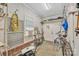 Bright storage room with shelves and various tools, plus a window AC unit and exterior access at 119 Era St, Troutman, NC 28166