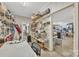 Utility room with storage shelves, work desk, and visible doorway to additional space at 119 Era St, Troutman, NC 28166