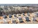 A stunning aerial view shows well-designed community featuring modern homes at 127 Tradesmen Trl, Troutman, NC 28166