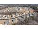 Wide aerial shot of a well-planned neighborhood with modern homes and tree-lined streets at 127 Tradesmen Trl, Troutman, NC 28166