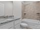 Bathroom with granite countertops, vanity, and tiled shower/tub at 127 Tradesmen Trl, Troutman, NC 28166