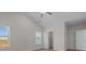 Bright bedroom featuring vaulted ceilings, light hardwood floors, and walk in closet at 127 Tradesmen Trl, Troutman, NC 28166