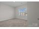 Bedroom with neutral carpet and natural light at 127 Tradesmen Trl, Troutman, NC 28166