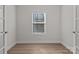 Bright bedroom featuring natural light from window and neutral wall paint and flooring at 127 Tradesmen Trl, Troutman, NC 28166