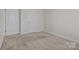 Bedroom with neutral carpet and two doors at 127 Tradesmen Trl, Troutman, NC 28166